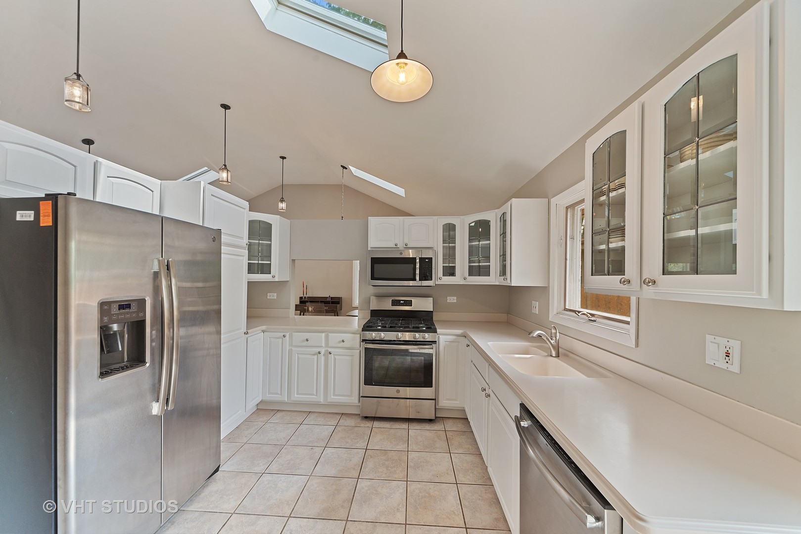 197 West Butterfield Road Elmhurst, IL 60126 - Photo 4 of 15 a kitchen with stainless steel appliances a refrigerator sink and stove
