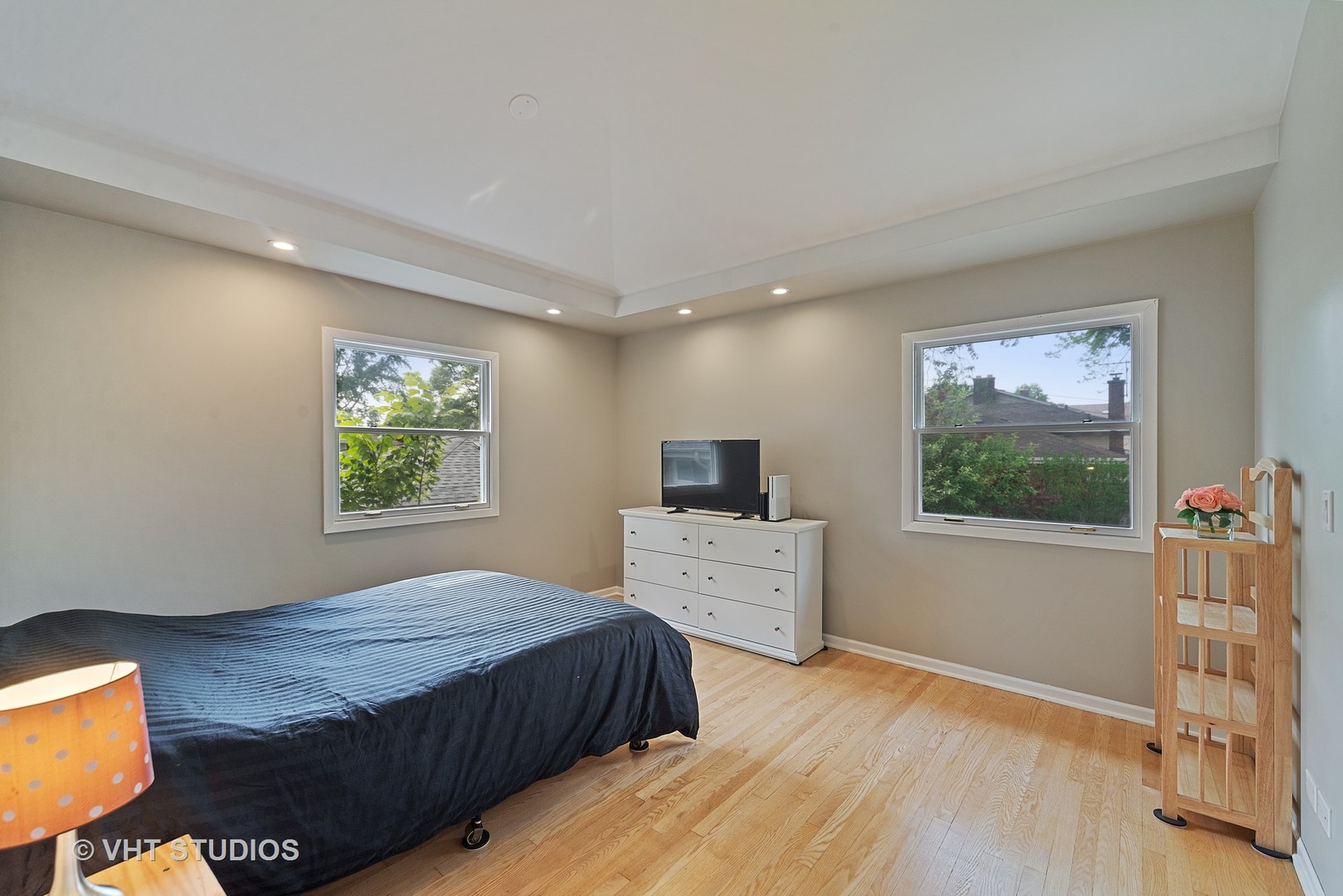 197 West Butterfield Road Elmhurst, IL 60126 - Photo 8 of 15 a bedroom with a bed and a flat screen tv
