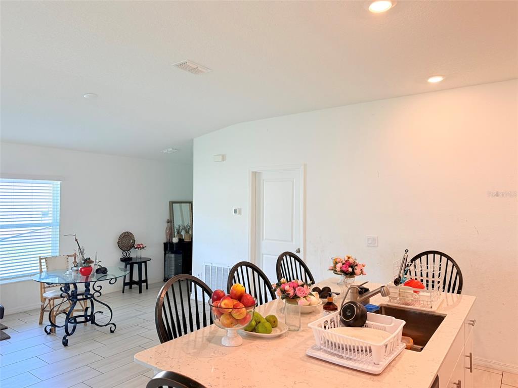 11244 Linden Depot Road San Antonio, FL 33576 - Photo 17 of 41 a dinning table and chairs in a room