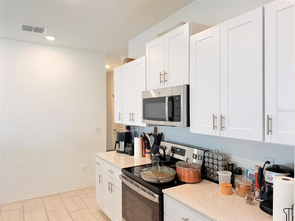 11244 Linden Depot Road San Antonio, FL 33576 - Photo 18 of 41 a kitchen with a sink cabinets and appliances