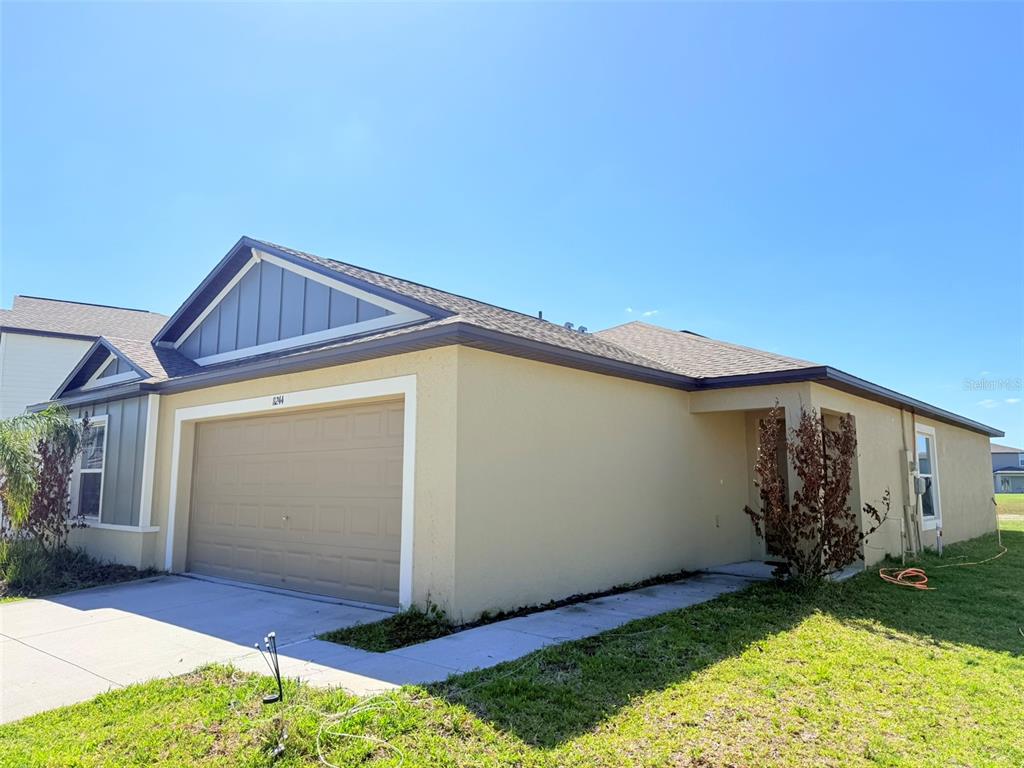 11244 Linden Depot Road San Antonio, FL 33576 - Photo 2 of 41 a view of an house with backyard space and garden