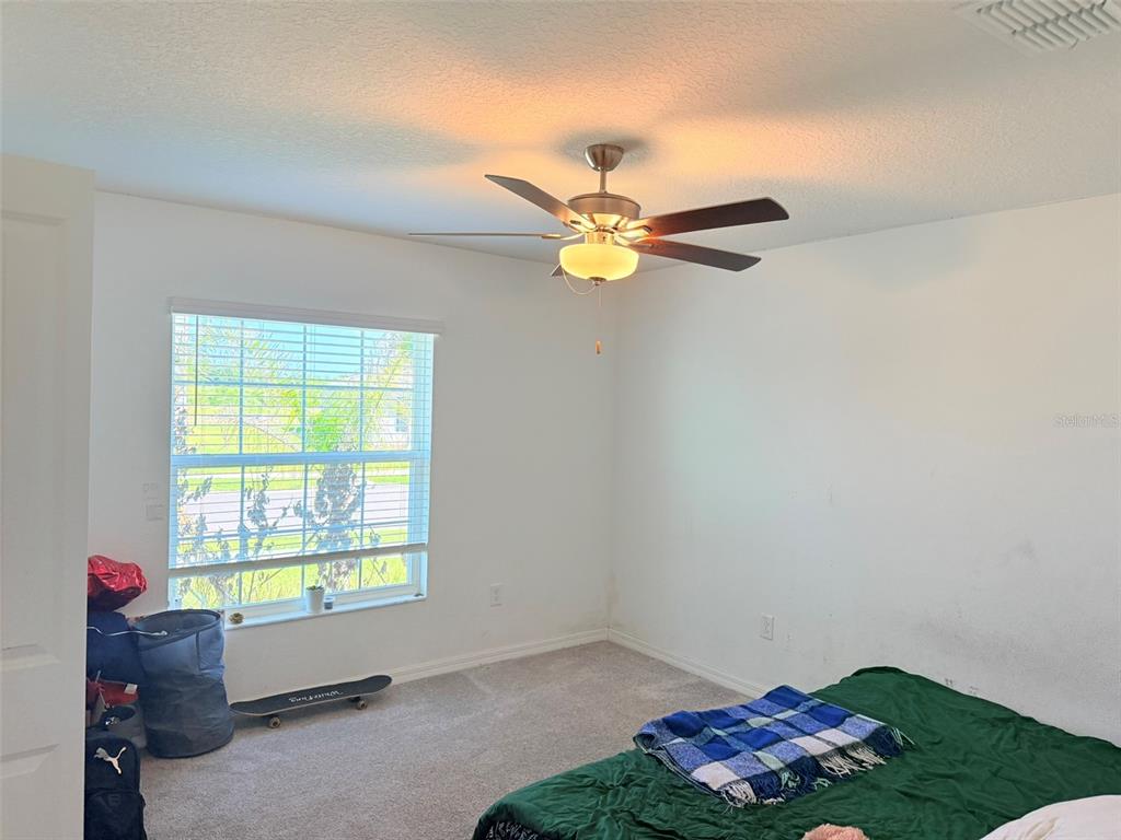 11244 Linden Depot Road San Antonio, FL 33576 - Photo 25 of 41 a room with window and a fan