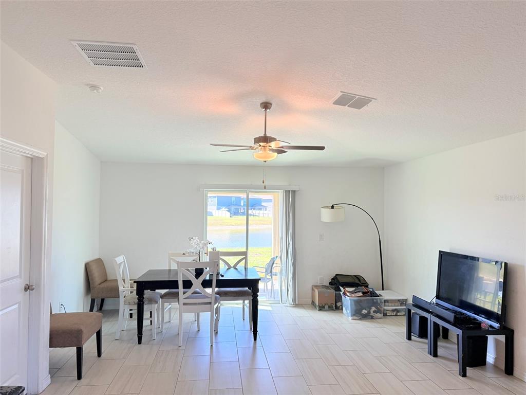 11244 Linden Depot Road San Antonio, FL 33576 - Photo 8 of 41 a view of a livingroom with furniture window and wooden floor