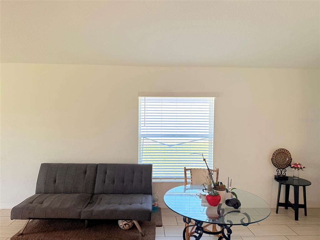 11244 Linden Depot Road San Antonio, FL 33576 - Photo 10 of 41 a living room with furniture and a window