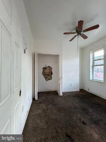 a view of a bathroom from a hallway