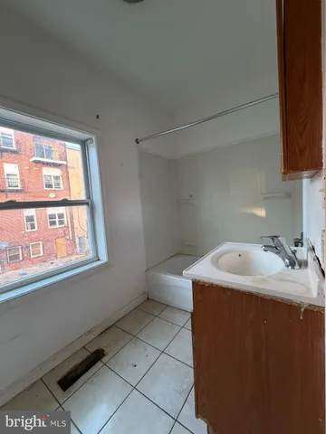 a view of a house with a snow in the yard
