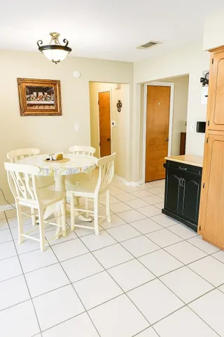 a view of a livingroom with furniture wooden floor and chandelier