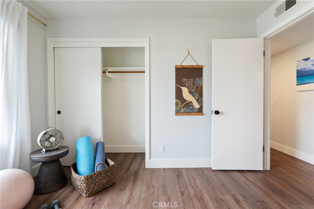 190 Verdon Street Morro Bay, CA 93442 - Photo 13 of 27 a room with furniture and wooden floor