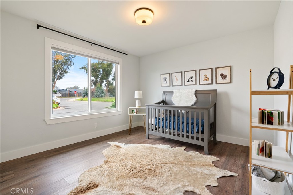 190 Verdon Street Morro Bay, CA 93442 - Photo 14 of 27 a bedroom with a bed and a window