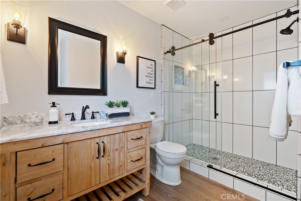 190 Verdon Street Morro Bay, CA 93442 - Photo 18 of 27 a bathroom with a granite countertop sink toilet and shower