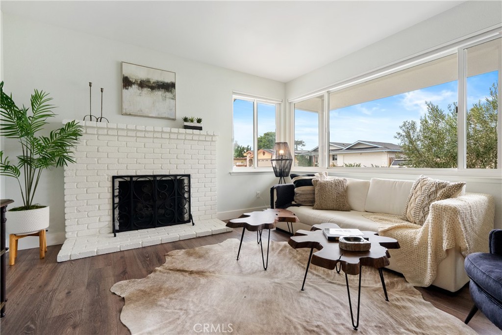 190 Verdon Street Morro Bay, CA 93442 - Photo 2 of 27 a living room with furniture a large window and a fireplace