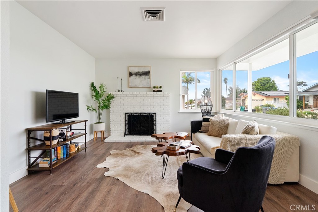 190 Verdon Street Morro Bay, CA 93442 - Photo 4 of 27 a living room with furniture a flat screen tv and a fireplace