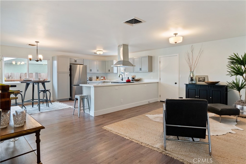 190 Verdon Street Morro Bay, CA 93442 - Photo 5 of 27 a living room with stainless steel appliances kitchen island granite countertop furniture and a dining table