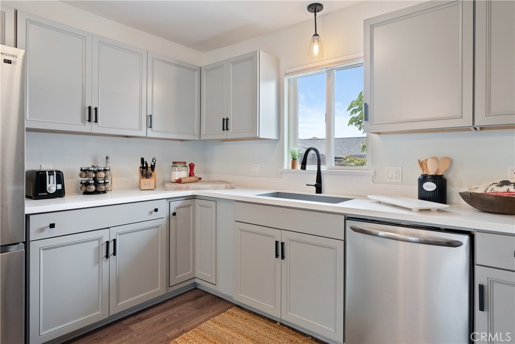 190 Verdon Street Morro Bay, CA 93442 - Photo 8 of 27 a kitchen with white cabinets sink and white appliances