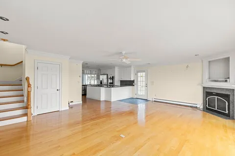 a view of a livingroom with furniture and an empty room
