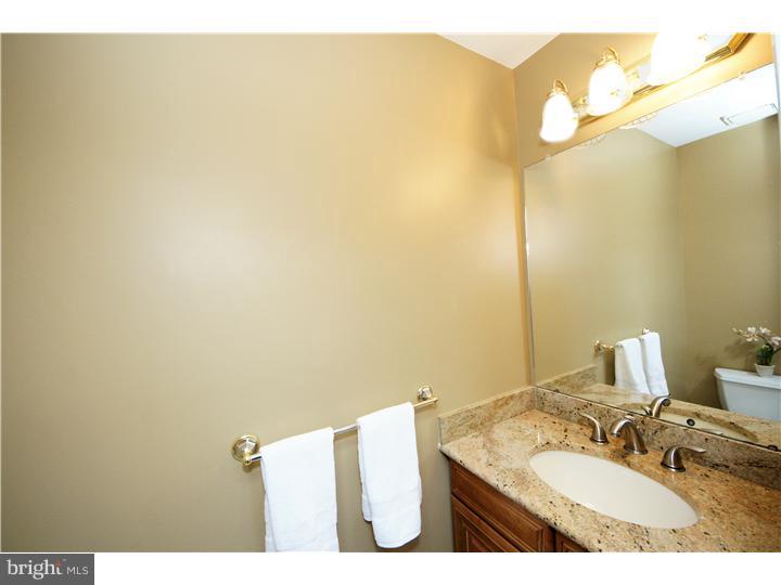 71 Amberfield Road Robbinsville, NJ 08691 - Photo 12 of 25 a bathroom with a sink and a mirror