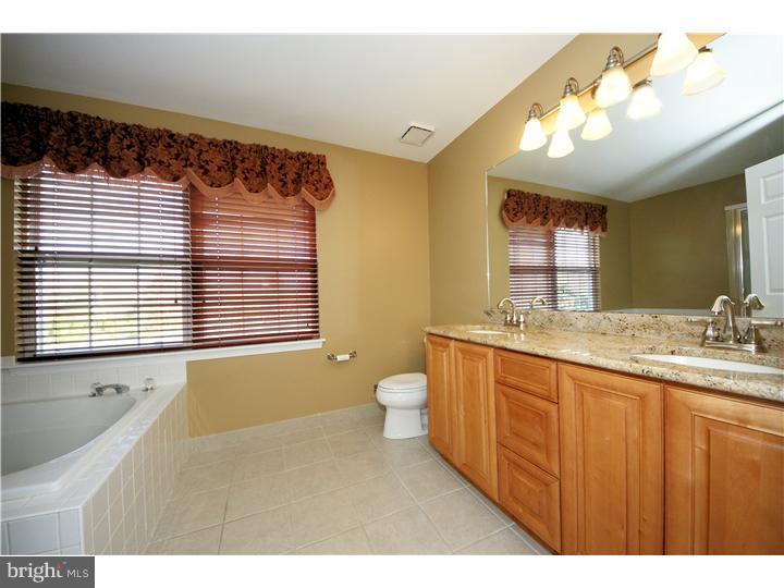 71 Amberfield Road Robbinsville, NJ 08691 - Photo 16 of 25 a bathroom with a granite countertop sink and a large mirror
