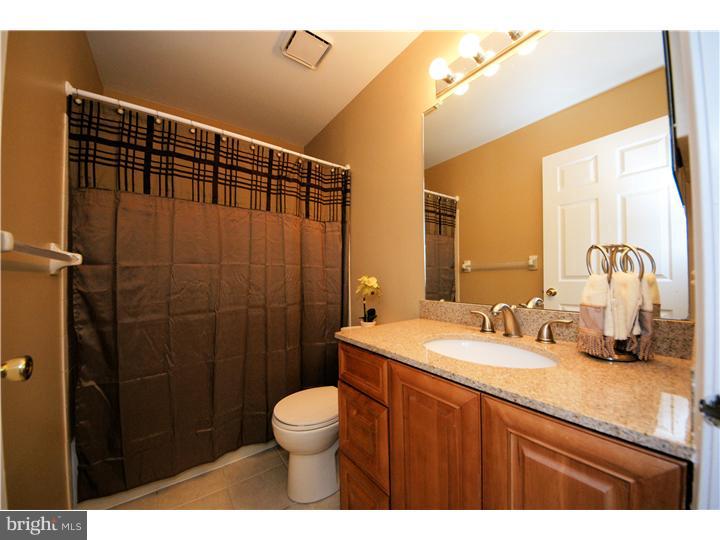 71 Amberfield Road Robbinsville, NJ 08691 - Photo 18 of 25 a bathroom with a sink a toilet and shower