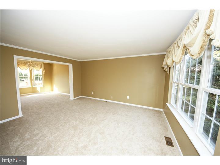 71 Amberfield Road Robbinsville, NJ 08691 - Photo 3 of 25 a view of an empty room with a window