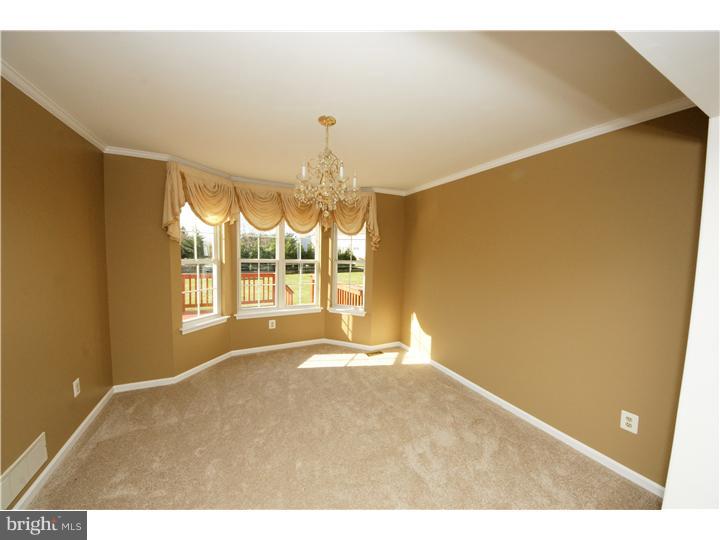 71 Amberfield Road Robbinsville, NJ 08691 - Photo 5 of 25 a view of an empty room with a window