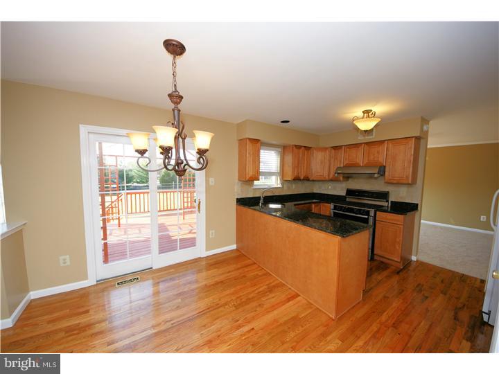 71 Amberfield Road Robbinsville, NJ 08691 - Photo 7 of 25 a kitchen with granite countertop a stove and a sink