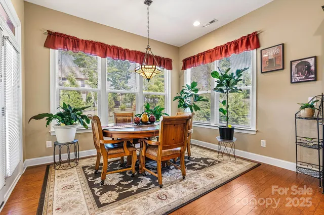 a work room with furniture and a potted plant