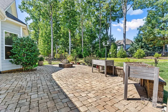 a view of a chairs and tables in the backyard of the house