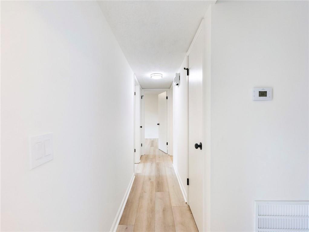 930 Woodbridge Drive Northeast Conyers, GA 30012 - Photo 18 of 38 a view of a room with wooden floor