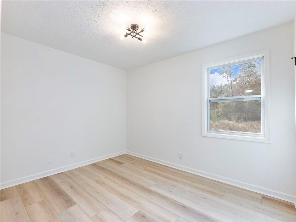930 Woodbridge Drive Northeast Conyers, GA 30012 - Photo 20 of 38 a view of empty room with window