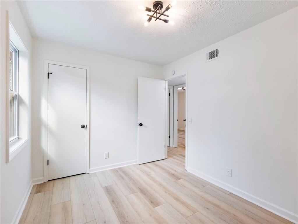 930 Woodbridge Drive Northeast Conyers, GA 30012 - Photo 21 of 38 a view of an empty room