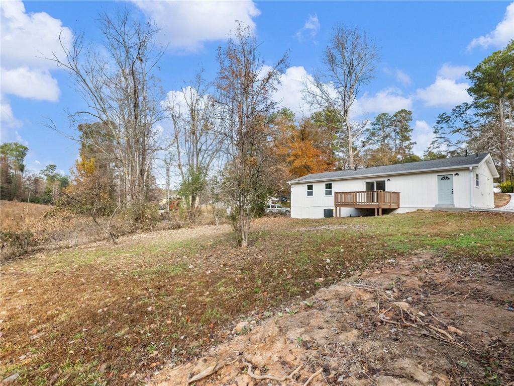 930 Woodbridge Drive Northeast Conyers, GA 30012 - Photo 37 of 38 a view of a house with a yard
