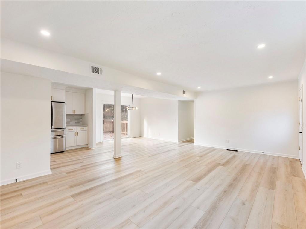 930 Woodbridge Drive Northeast Conyers, GA 30012 - Photo 8 of 38 a view of empty room with wooden floor