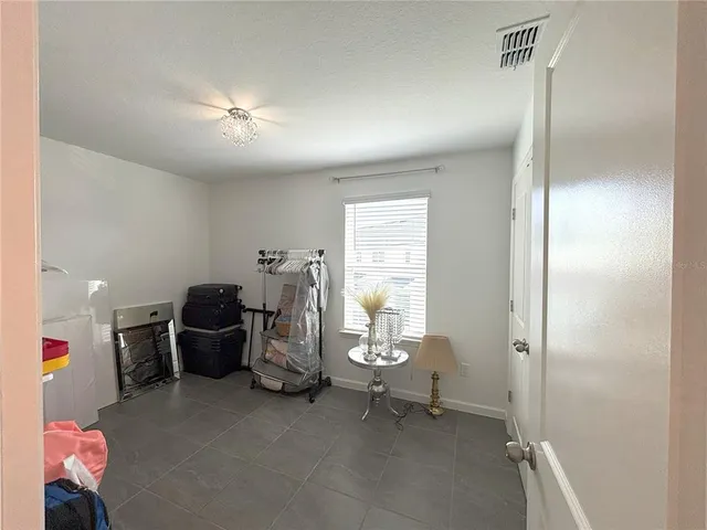 a view of a room with air conditioner and windows