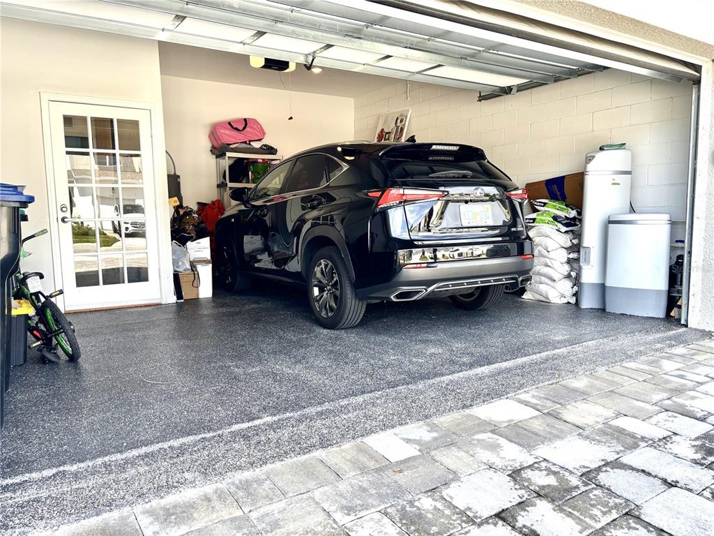 921 Spring Palms Loop Orlando, FL 32828 - Photo 36 of 43 a view of a garage with parked cars