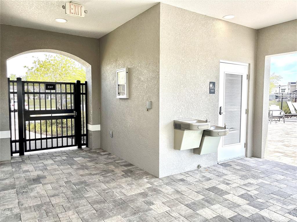 921 Spring Palms Loop Orlando, FL 32828 - Photo 39 of 43 a view of an empty room with large window and a swimming pool