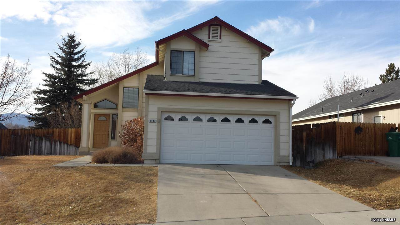 1197 Backer Way Reno, NV 89523 - Photo 1 of 1 a front view of a house with a yard and garage