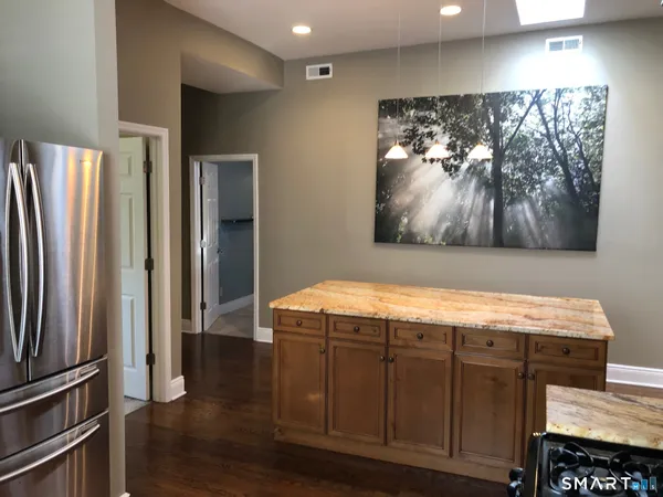 a room with furniture and wooden floor