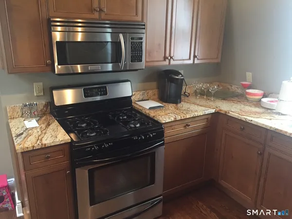 a kitchen with a stove and a microwave