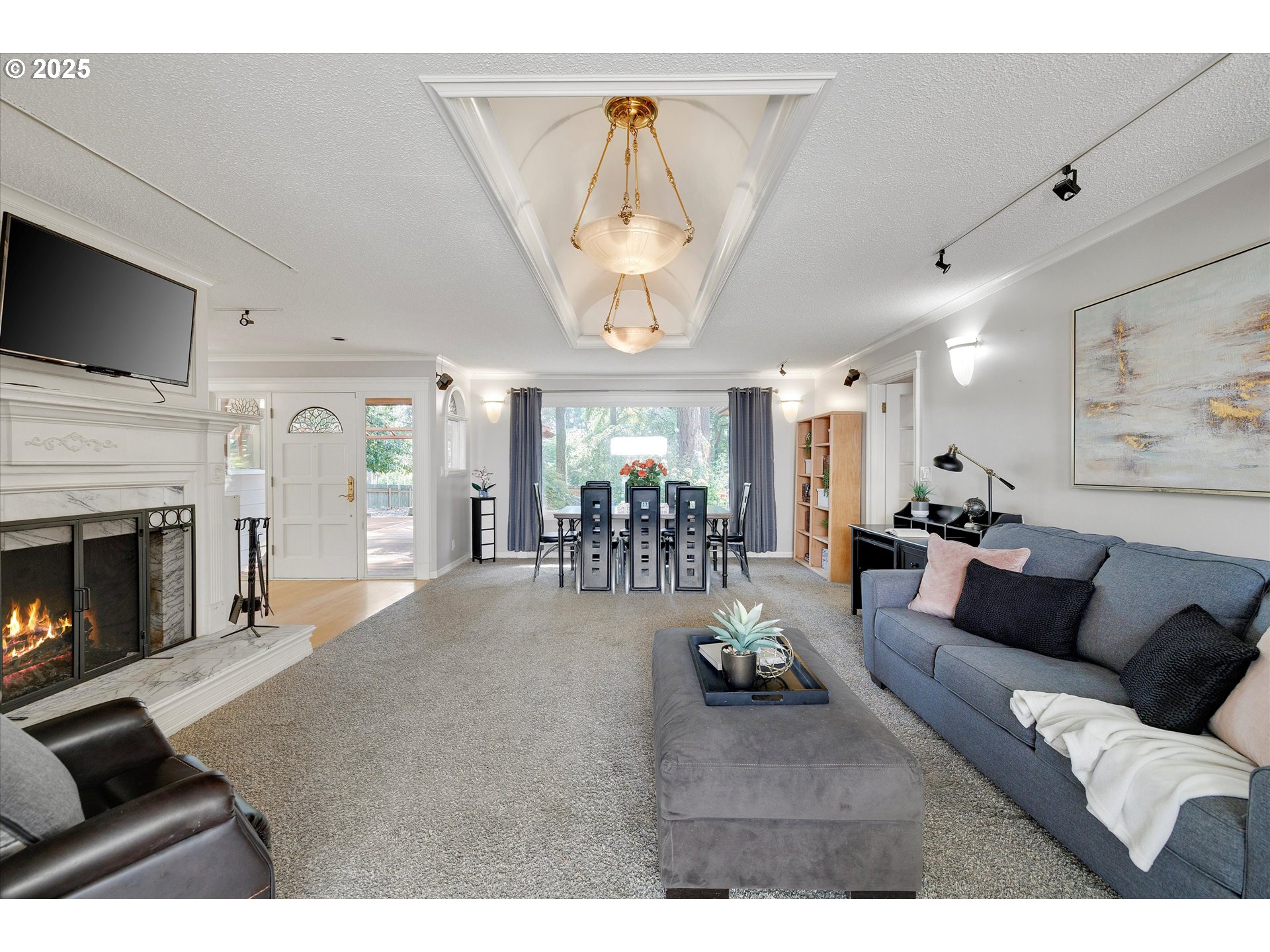 8815 Southwest Oleson Road Portland, OR 97223 - Photo 11 of 46 a living room with furniture and a fireplace