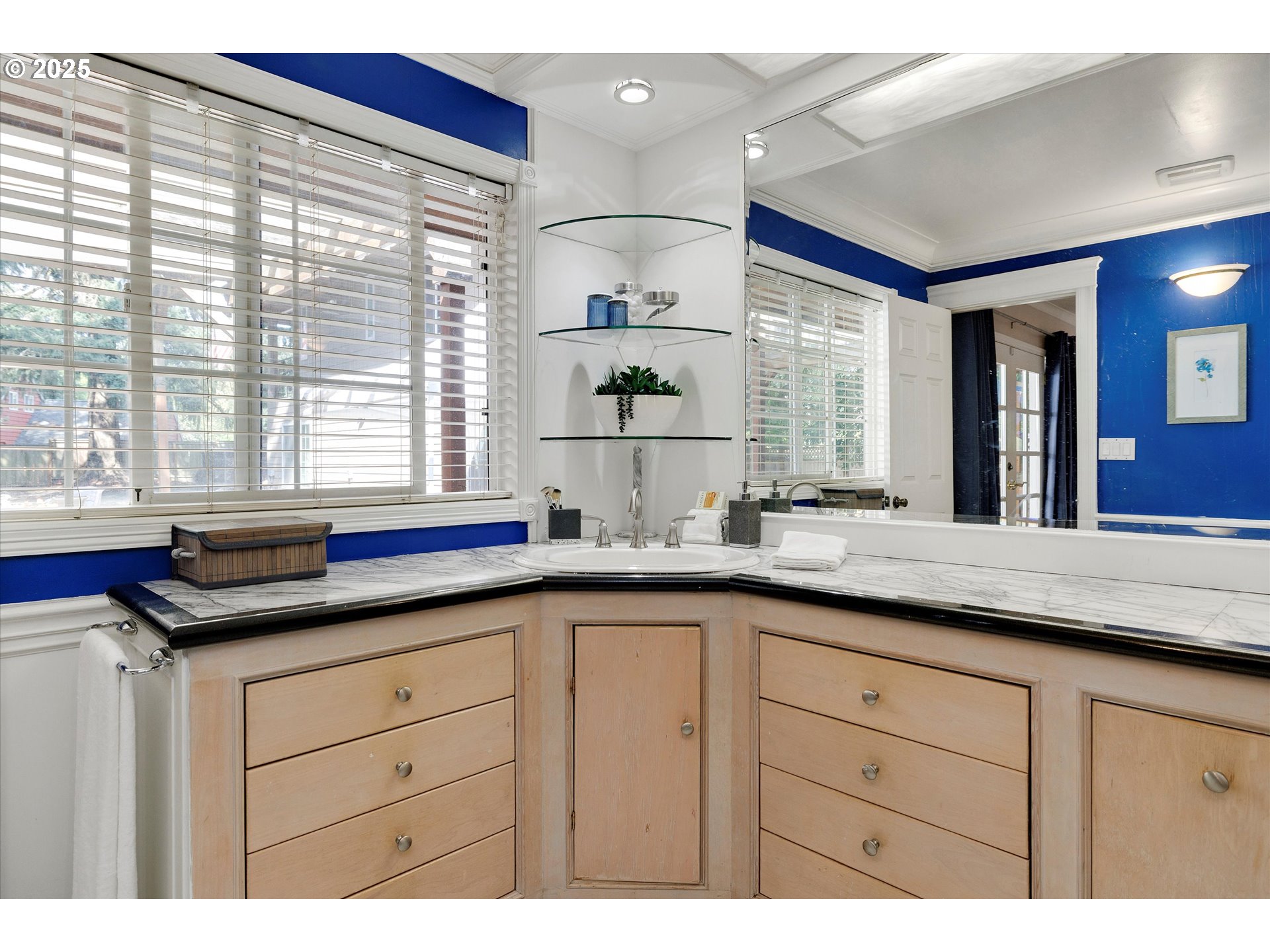 8815 Southwest Oleson Road Portland, OR 97223 - Photo 14 of 46 a kitchen with granite countertop a sink and white cabinets