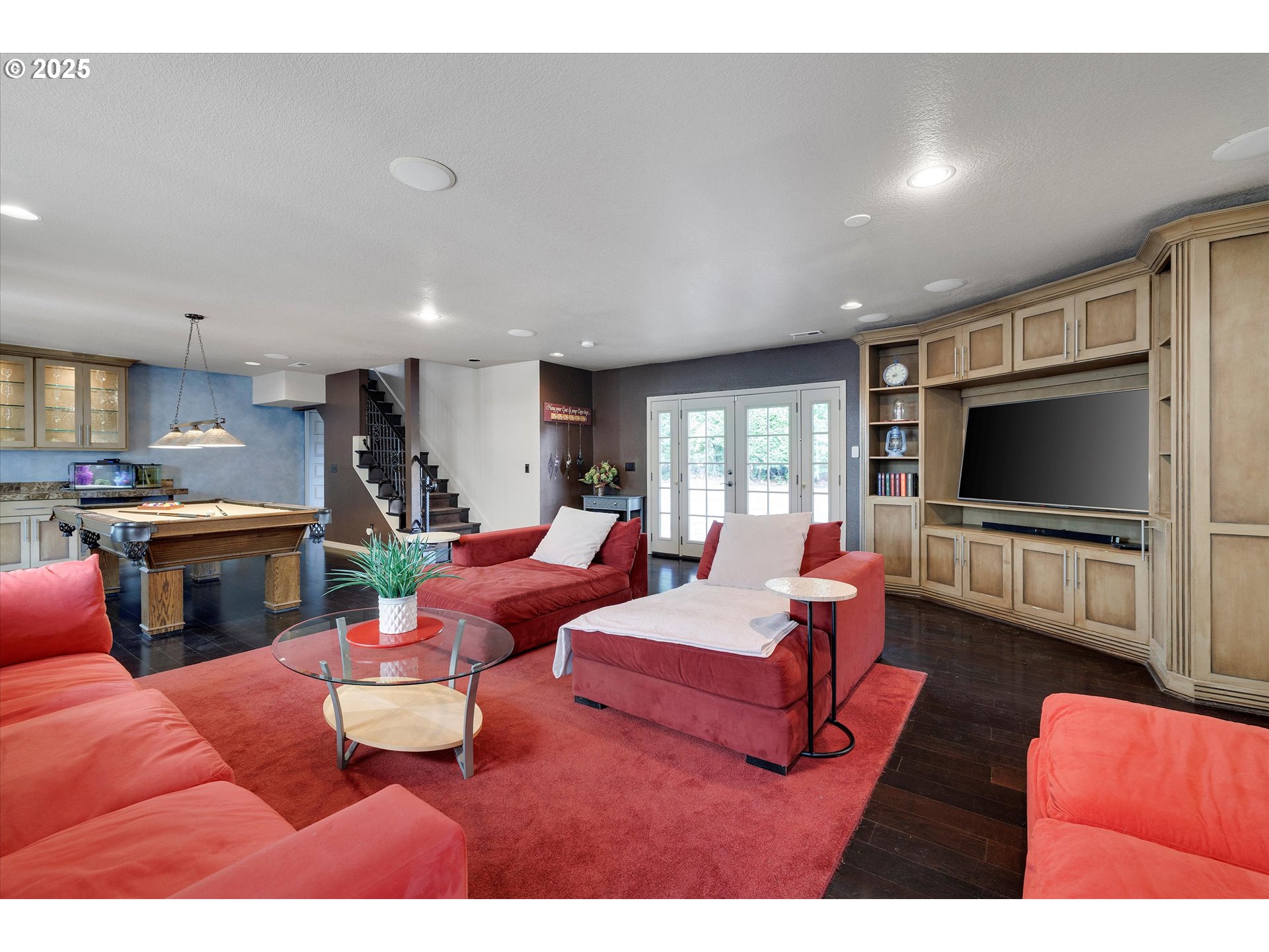 8815 Southwest Oleson Road Portland, OR 97223 - Photo 26 of 46 a living room with furniture and a flat screen tv