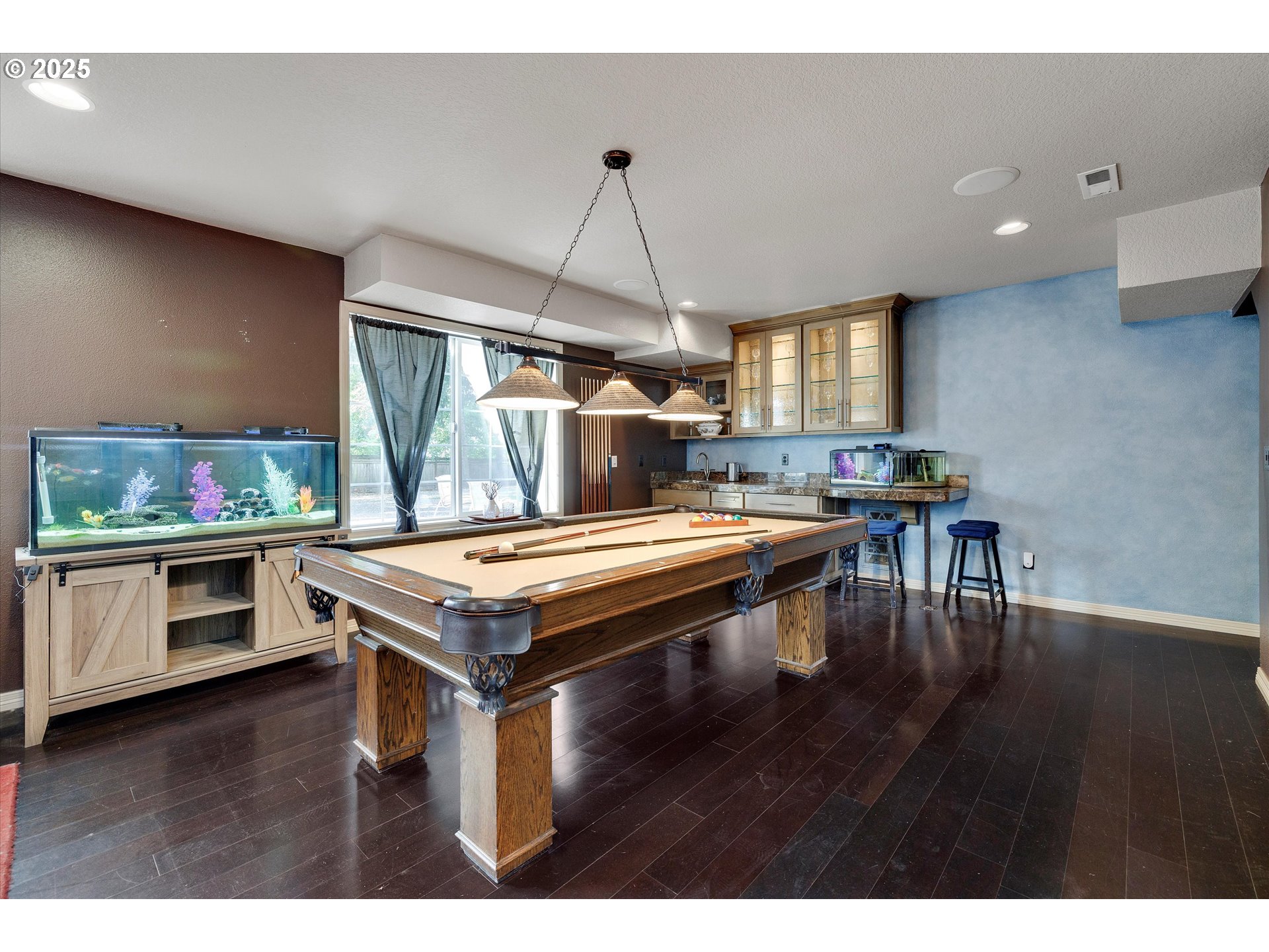 8815 Southwest Oleson Road Portland, OR 97223 - Photo 27 of 46 a kitchen with stainless steel appliances granite countertop a stove and a wooden floors
