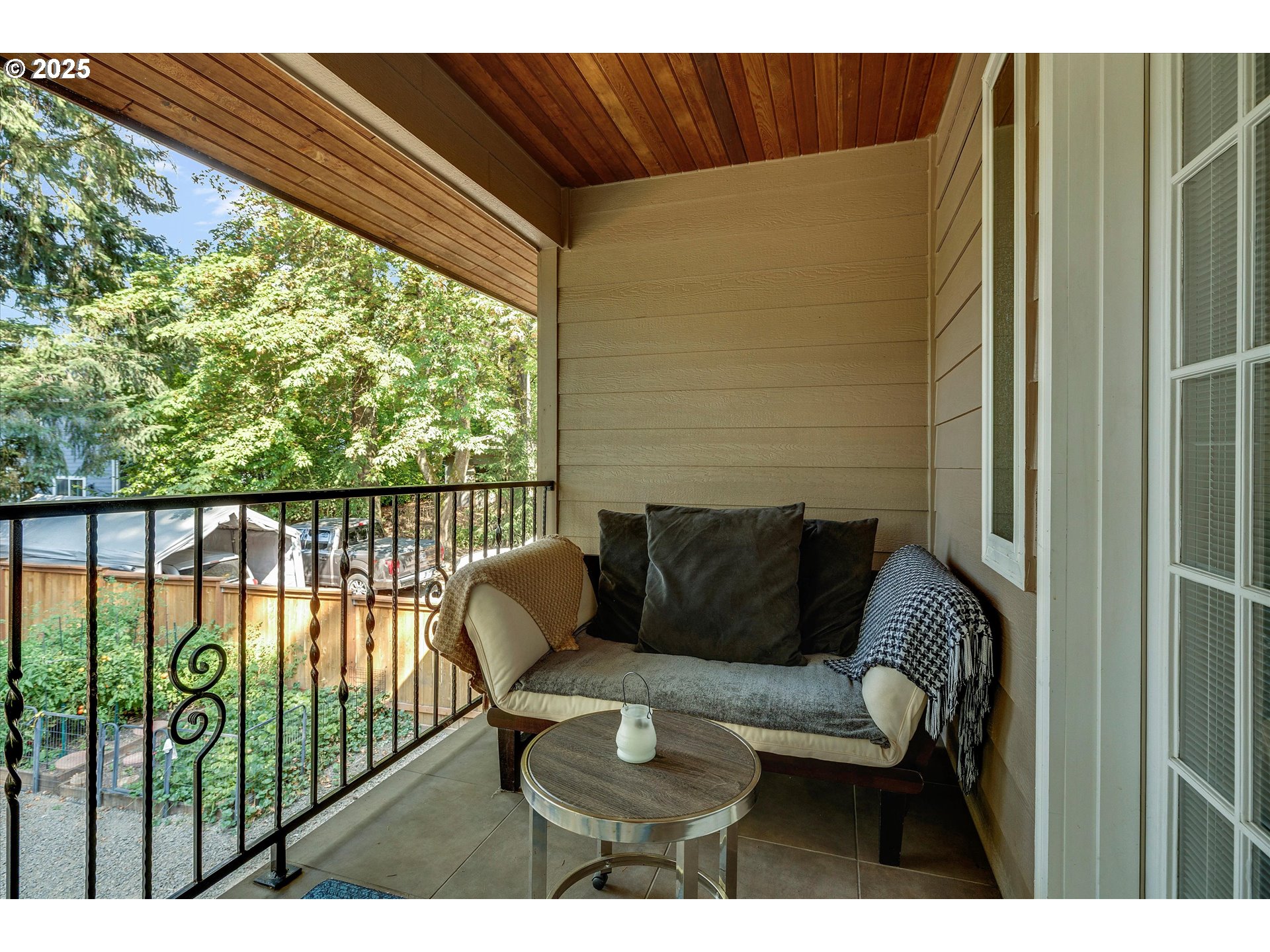 8815 Southwest Oleson Road Portland, OR 97223 - Photo 30 of 46 a balcony with table and chairs