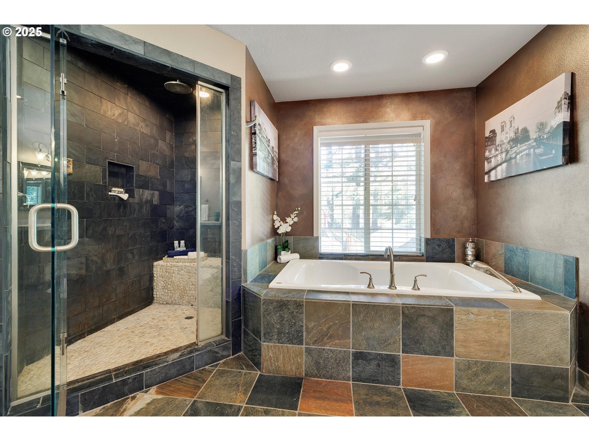 8815 Southwest Oleson Road Portland, OR 97223 - Photo 31 of 46 a bathroom with a tub a double vanity sink and glass door