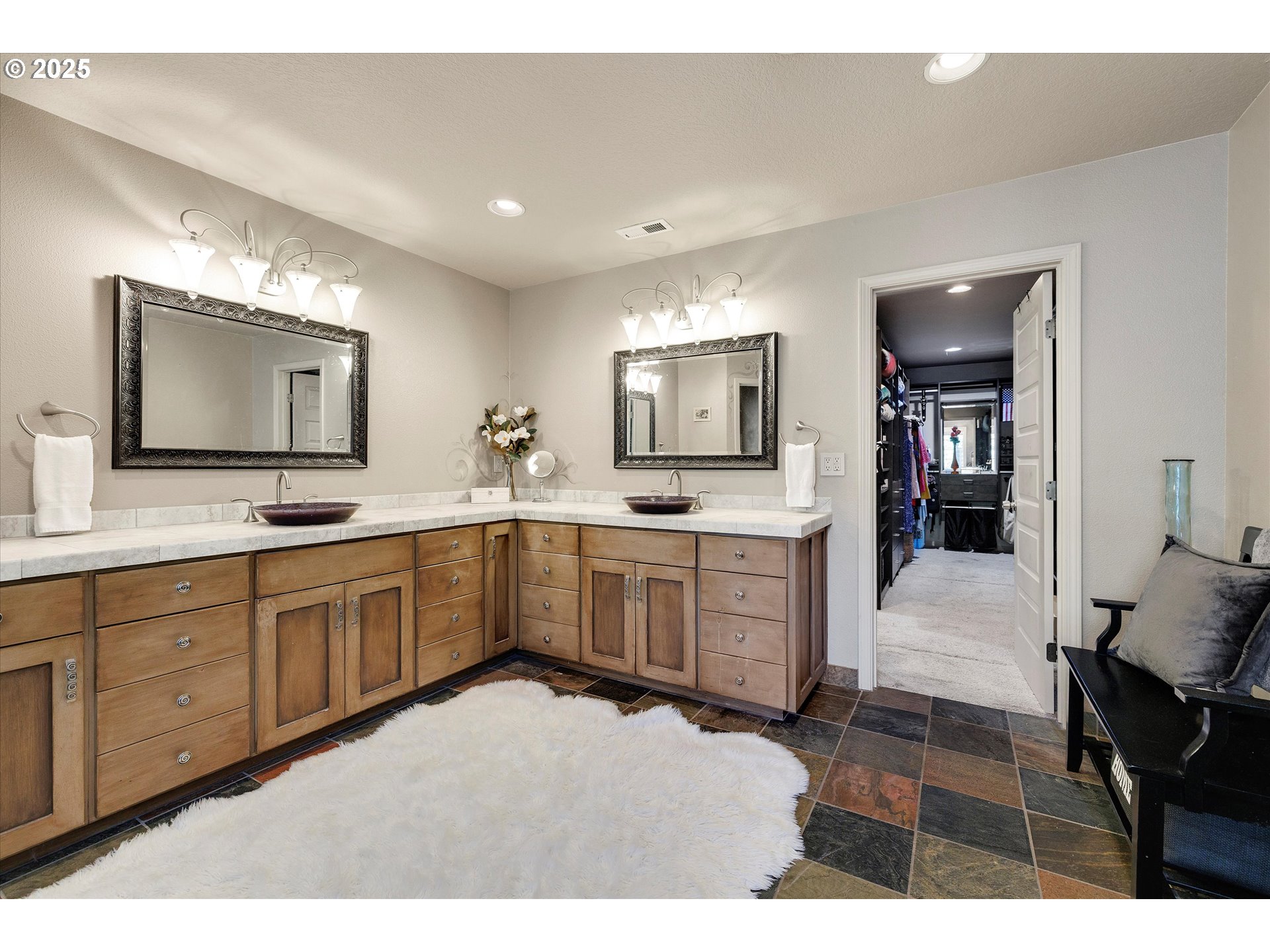 8815 Southwest Oleson Road Portland, OR 97223 - Photo 32 of 46 a open kitchen with granite countertop a sink dishwasher stove and white cabinets with wooden floor