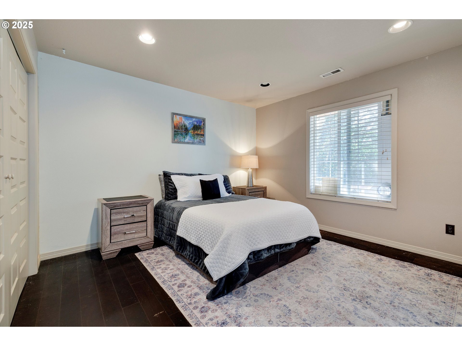 8815 Southwest Oleson Road Portland, OR 97223 - Photo 34 of 46 a bedroom with a bed and a night stand