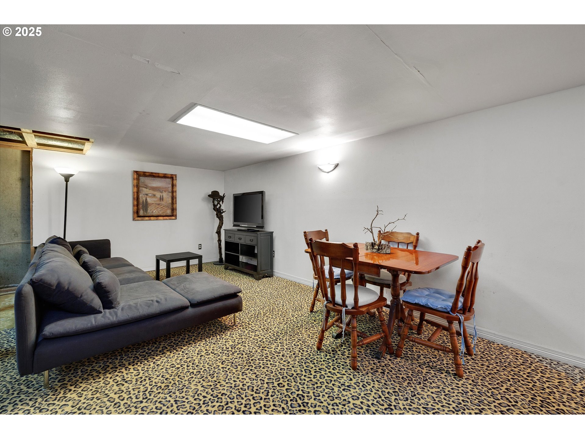 8815 Southwest Oleson Road Portland, OR 97223 - Photo 39 of 46 a living room with furniture a dining table and a piano