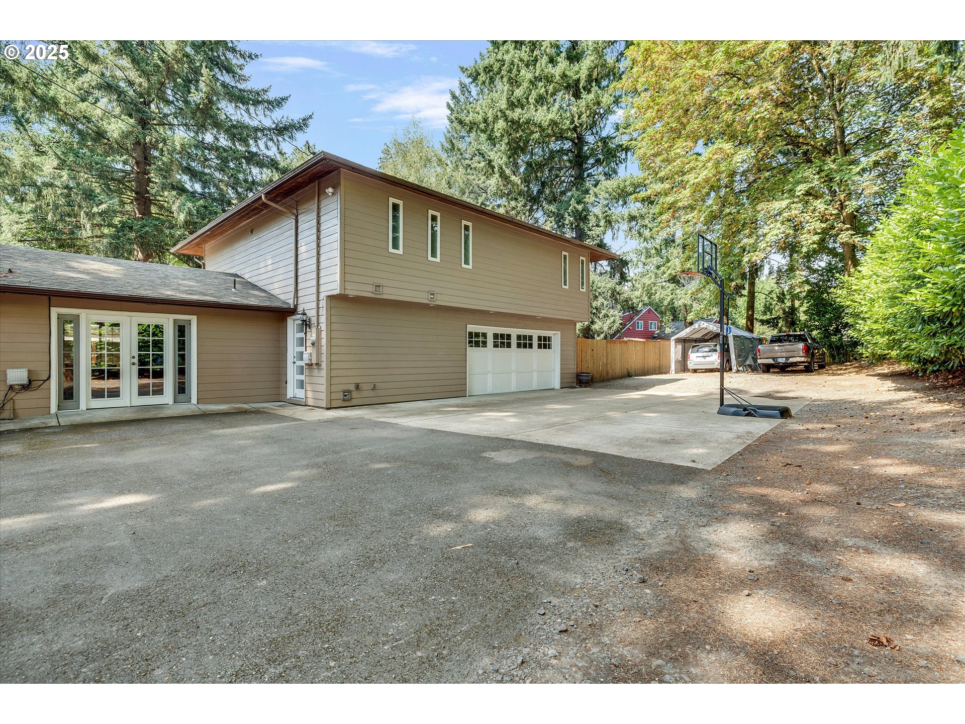 8815 Southwest Oleson Road Portland, OR 97223 - Photo 4 of 46 a view of a house with backyard and a tree