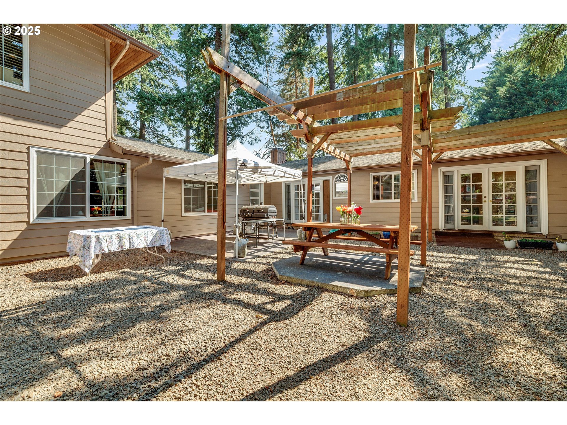 8815 Southwest Oleson Road Portland, OR 97223 - Photo 42 of 46 a view of a house with a patio