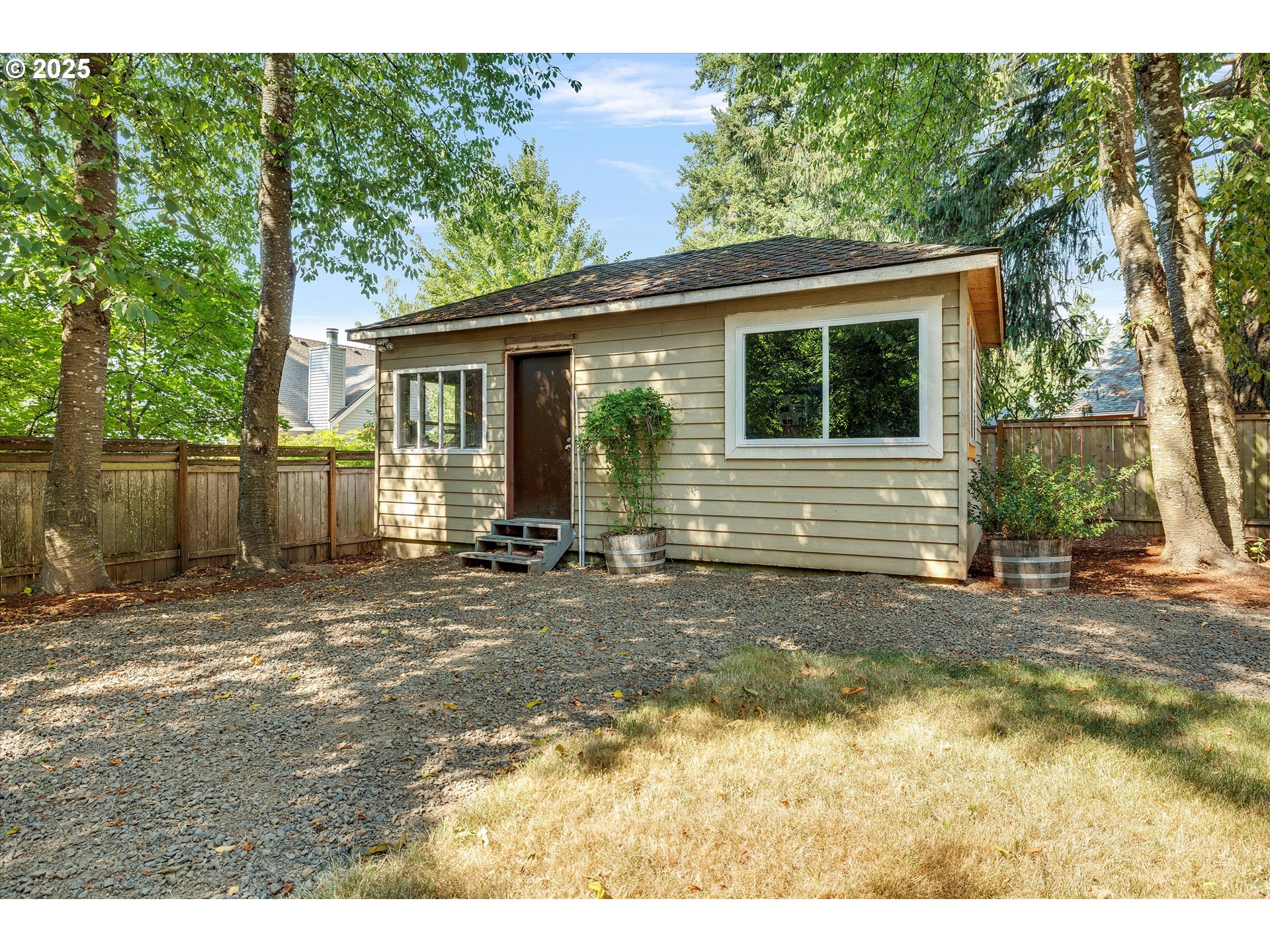 8815 Southwest Oleson Road Portland, OR 97223 - Photo 44 of 46 a view of a house with a yard